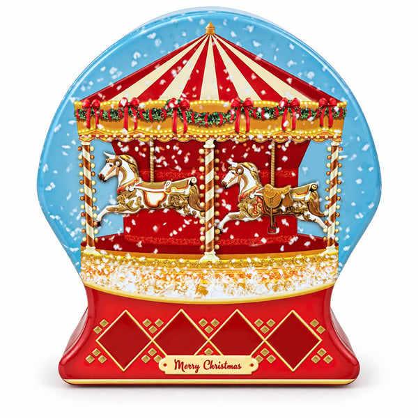 A Christmas-themed snow globe decoration featuring a red and gold carousel with white horses under a blue snowy sky, with 'Merry Christmas' written on the base.