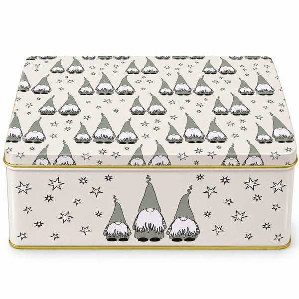 A rectangular metal tin with a lid, decorated with a repeating pattern of gray and white gnomes and small black stars on a warm cream background, with a thin gold-toned rim.