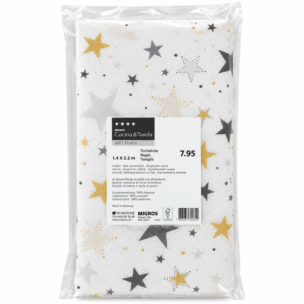 Packaged kitchen towel with a white background and a star pattern in gold, silver, and gray, sealed in a clear plastic bag with a white product label.