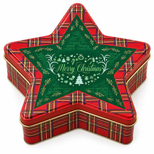 A star-shaped metal tin with a red plaid pattern and a large green central panel featuring white 'Merry Christmas' script and holiday illustrations, shown on a white background.