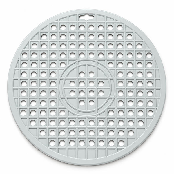 A round, light gray plastic trivet or mat with a grid pattern of circular cutouts and a small hanging hole at the top, shown on a plain white background.
