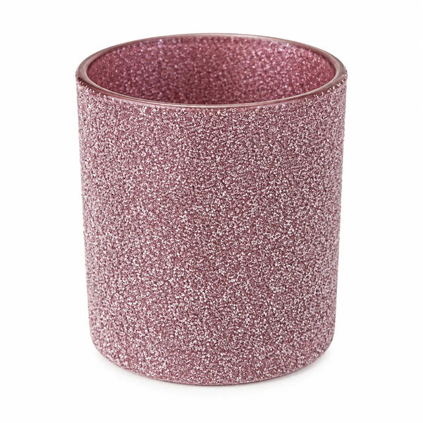 A cylindrical glittery cup or candle holder in a dusty rose pink color, shown on a plain white background.