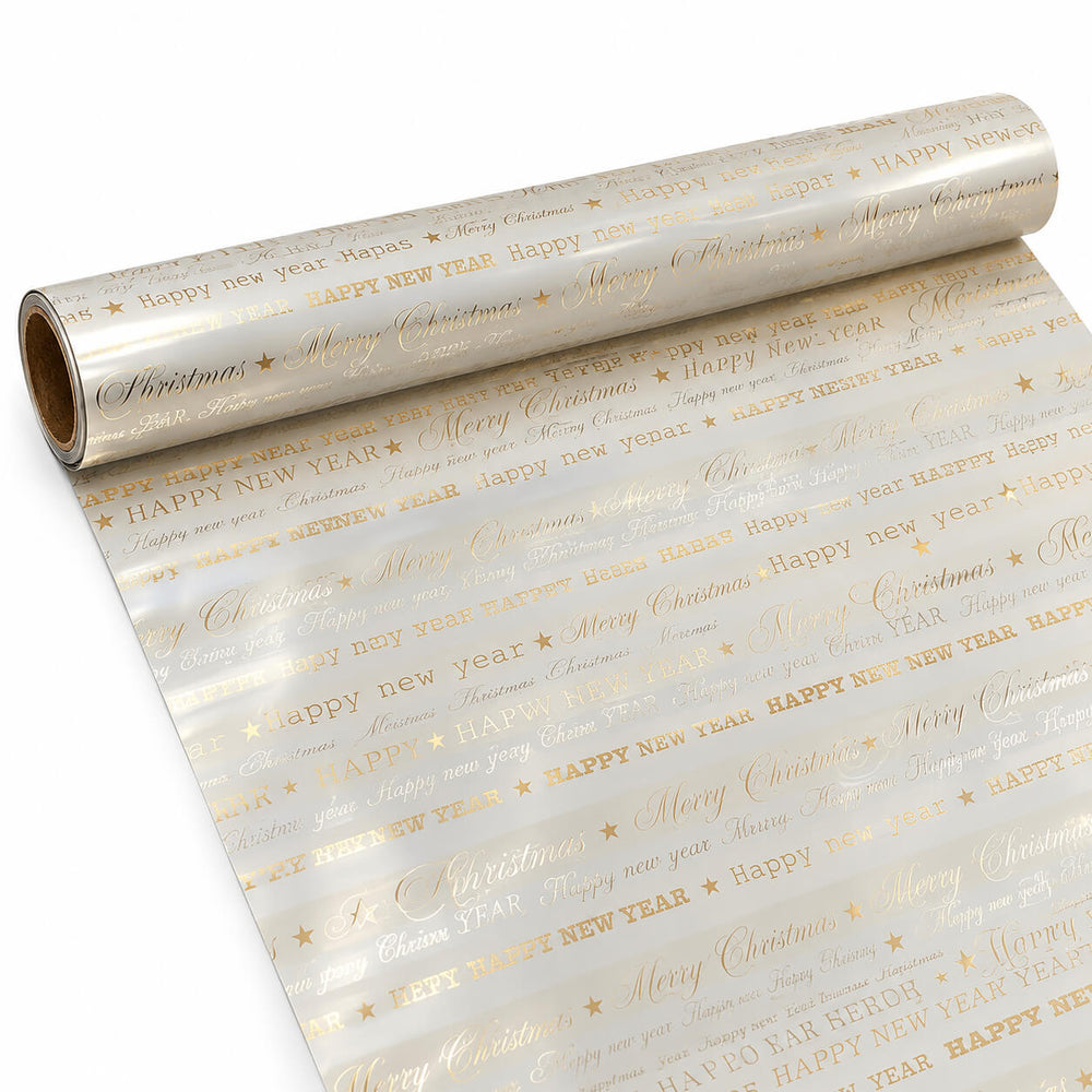 Gold and white Christmas wrapping paper with 'Merry Christmas' and 'Happy New Year' text, shown both rolled out and wrapped around gift boxes with a gold ribbon and bow, surrounded by holiday decorations.