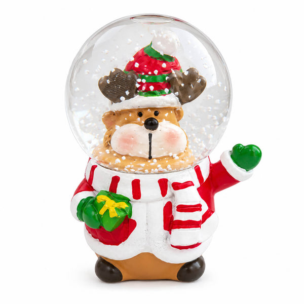 A Christmas-themed animal snow globe figurine featuring a reindeer inside a clear glass-like sphere, wearing a red and green Santa hat, white sweater with red stripes, and holding green mittens, on a plain white background.