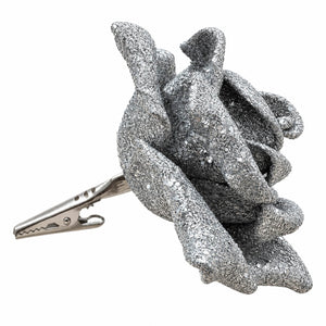 A silver glitter rose-shaped hair clip with a metal spring clip fastener, shown on a plain white background.