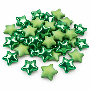 A pile of small metallic star-shaped beads in shades of green on a plain white background.