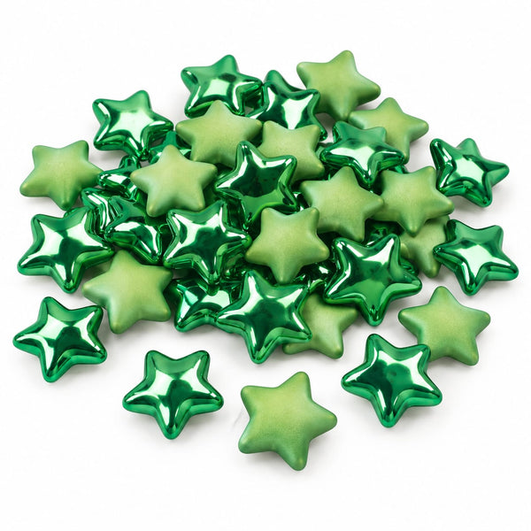 A pile of small metallic star-shaped beads in shades of green on a plain white background.