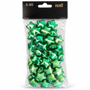 Pack of green metallic star-shaped confetti or ornaments in a clear plastic bag with a black header card labeled '5.90 noël'.