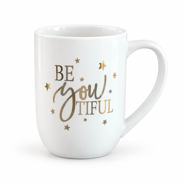A white ceramic mug with the phrase 'BE YOU TIFUL' in metallic gold and brown lettering, decorated with small gold and brown stars, on a clean white background.