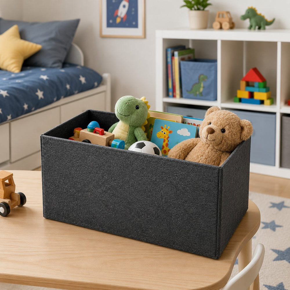 Dark gray felt storage box filled with children's toys, books, and plush animals on a table in a modern kids' bedroom with organized toy storage and playful décor.