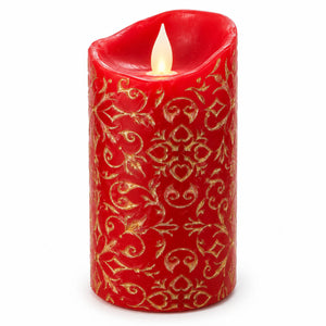 A red wax candle with a gold ornamental damask pattern and a glowing flame effect, shown on a plain white background.