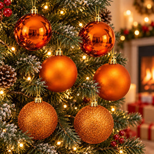 Migros Charme copper-orange baubles set of 6 displayed on a decorated Christmas tree with warm lights