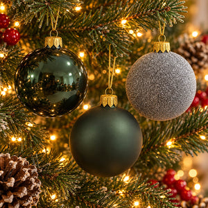 Migros green Christmas baubles set of 3 hanging on a festive Christmas tree