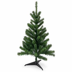 An artificial Christmas tree with dense green needles on a black metal tripod stand, photographed against a solid white background.
