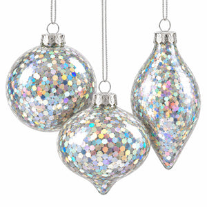 Three silver holographic Christmas ornaments hanging against a white background, including two round balls and one teardrop-shaped ornament covered in iridescent glitter.