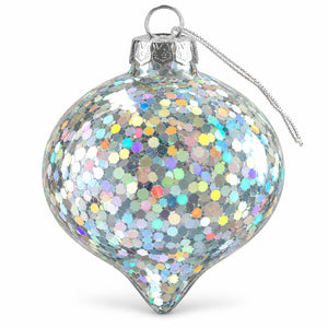 A silver-toned glass Christmas ornament covered in dense iridescent hexagonal glitter, with a silver metal cap and hanging loop, shown on a clean white background.