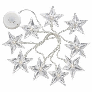 Clear acrylic star-shaped string lights with a white power adapter, shown on a plain white background.