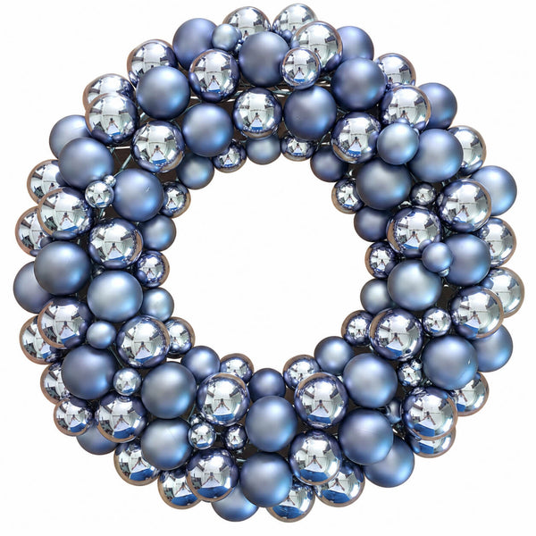 A decorative wreath made of layered blue and silver glass beads and faceted crystal-like spheres on a plain white background.