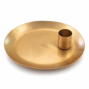 A brushed gold metal serving platter with a small matching cylindrical cup or candle holder set in the center, shown on a clean white background.