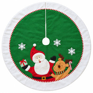 A round Christmas tree skirt with a green center, white outer border, red and white stitched trim, white snowflakes, and embroidered Santa Claus and a brown reindeer holding candy canes.