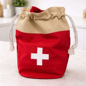 Red drawstring bag with a white cross on a light background