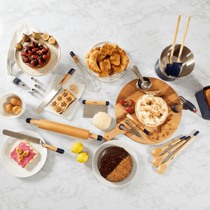 Assorted baking tools and ingredients on a marble surface