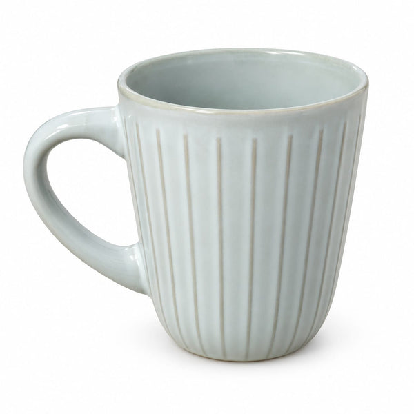 A light blue-gray ceramic mug with a fluted vertical ribbed design and a curved handle, shown on a plain white background.