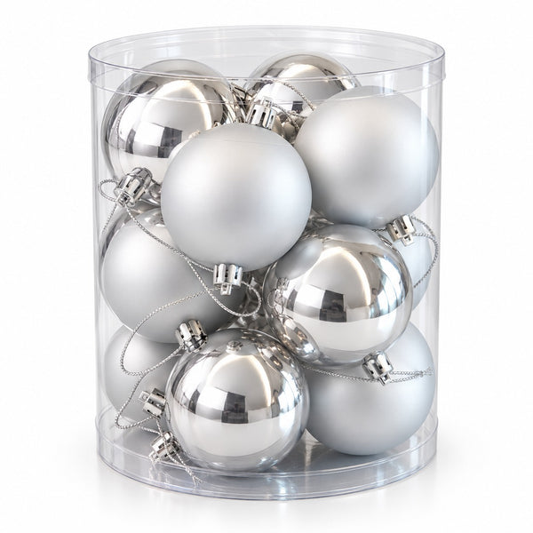 A clear cylindrical plastic container filled with multiple silver Christmas ornaments, including both matte frosted silver and shiny metallic silver baubles, on a white background.