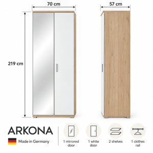 A product dimension diagram for an ARKONA wardrobe. The image shows two views of the wardrobe: a front view with mirrored double doors (70 cm wide, 219 cm tall) and a side profile view (57 cm wide, light wood finish).