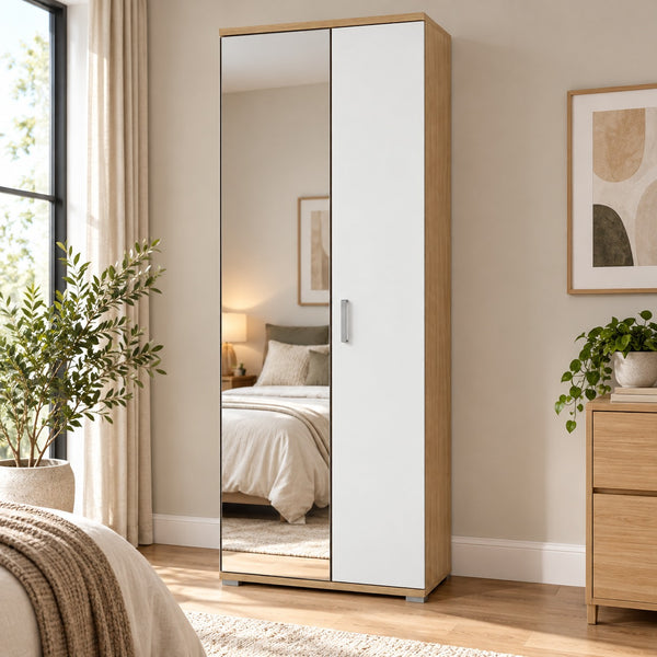 A tall two-door wardrobe with two white doors and light wood frames, one door featuring a large mirror, shown in a styled bedroom setting.