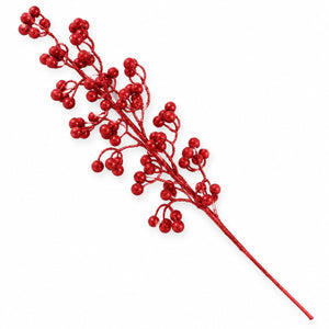 A single decorative red berry branch with many small glossy red berries on a white background.