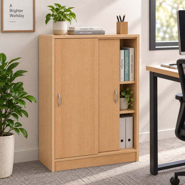 A light natural wood sliding cabinet with two doors and open shelves, styled in a home office setting next to a desk and plants.