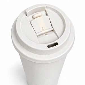 A close-up of a reusable paper coffee cup with a light beige textured lid featuring a flip-up straw cover and a small drainage hole, shown on a white background.