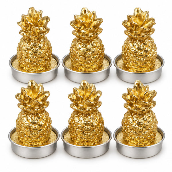 Six metallic gold pineapple-shaped items arranged in two rows of three on a white background, each resting in a small round silver tray with a textured beige insert.