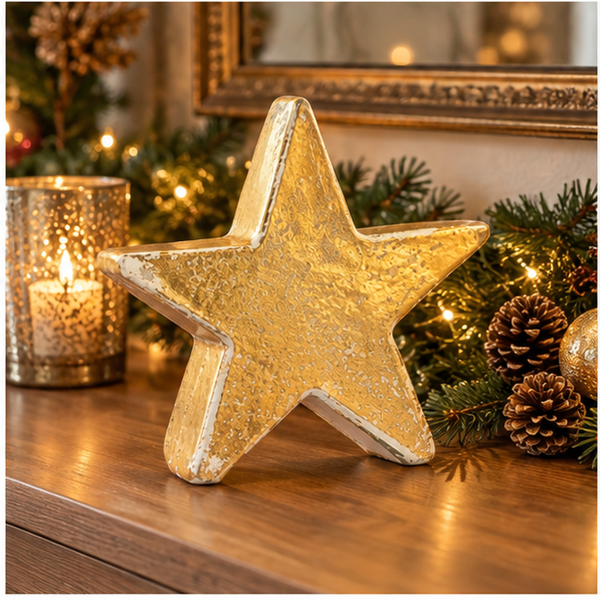 Gold ceramic Christmas star displayed in an elegant festive Christmas setting