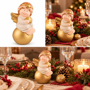 A Christmas angel figurine sitting on a gold ornament, shown in a clean studio shot and in a warm holiday table setting with candles, pinecones, and red berries.