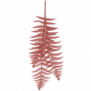 A single hanging artificial fern decoration in a rust red color, shown against a plain white background.