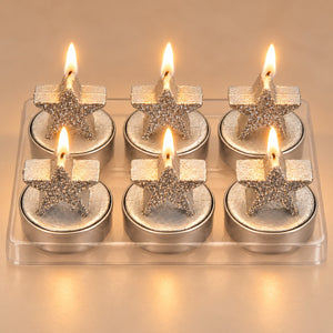 Migros set of 6 silver star Christmas candles on white background