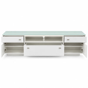 A modern white media console with a light green glass top, featuring multiple drawers, open shelves, and cabinet doors shown in an open position against a white background.