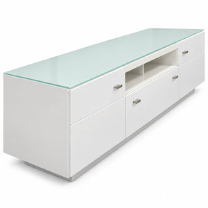 A modern white media console with a clear glass top, featuring multiple drawers, open shelving, and small silver metal handles, shown on a white background.