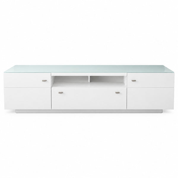 A modern white media console with a frosted glass top, featuring three cabinet doors, two drawer fronts, and an open center shelf, shown against a plain white background.