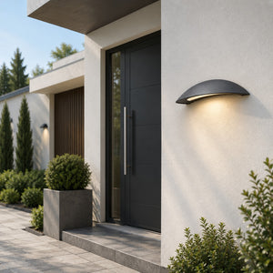 Massive Pori outdoor wall light installed beside a modern villa entrance during dayligh