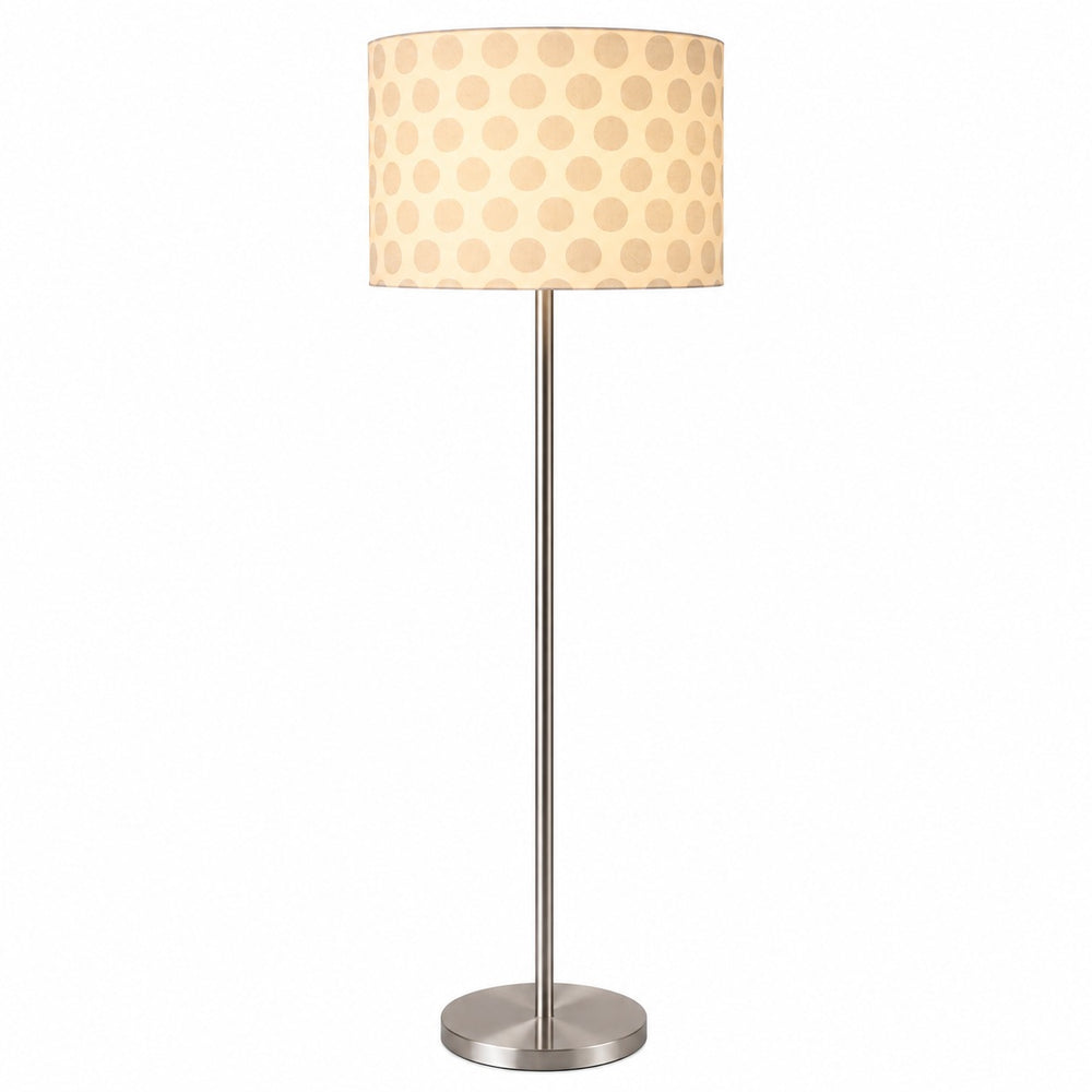 Micasa modern floor lamp with brushed nickel finish and white patterned fabric shade illuminating a contemporary hotel lounge with elegant ambient lighting.
