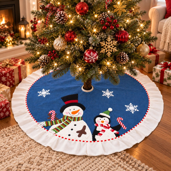 A round Christmas tree skirt with a white ruffled edge and a blue center, featuring embroidered snowmen and snowflakes, shown under a decorated Christmas tree in a living room setting.