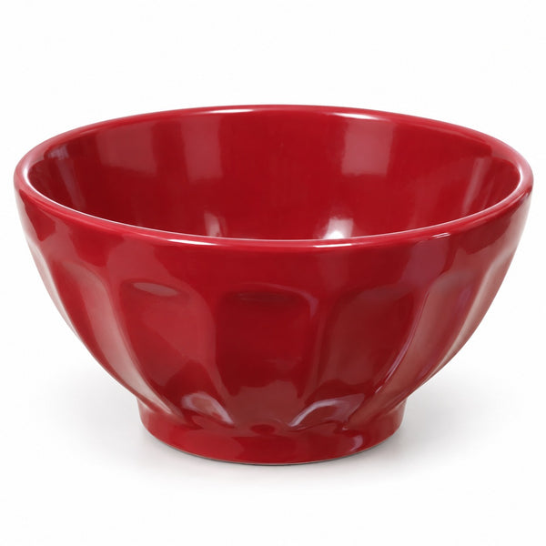 A glossy red ceramic bowl with a fluted, scalloped exterior pattern, shown on a clean white background.