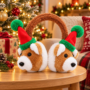 A pair of plush dog-shaped earmuffs with brown faux fur dog faces, red and green Santa hats, and a brown loop handle, displayed on a wooden table in a cozy Christmas living room setting.