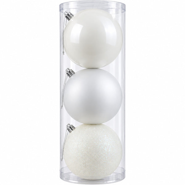 Three white Christmas ornaments in different finishes—matte, glossy, and glitter—stored inside a clear cylindrical plastic container on a white background.