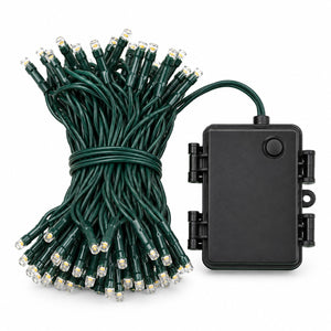 Migros Noël 50 warm white LED string lights with green cable and battery box on white background