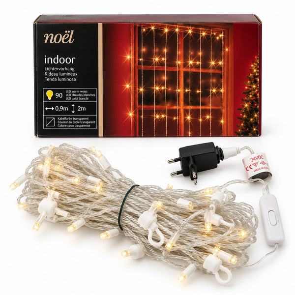 Noïel indoor Christmas string lights with warm white LED bulbs on a clear wire, shown coiled with its power adapter, switch, and retail box on a white background.