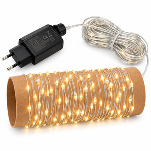 Warm white LED fairy string lights coiled on a brown cardboard tube, with a black power adapter and clear wire shown on a white background.